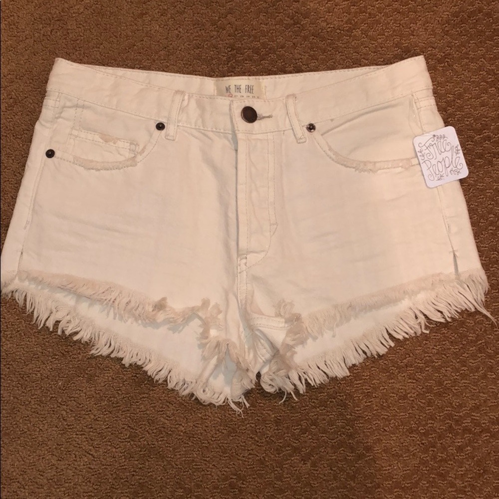 Free people white distressed denim shorts